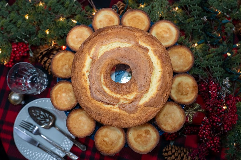 Granny’s Gift 7UP pound cake surrounded by snack cakes on a Christmas table